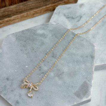 Gold bow necklace