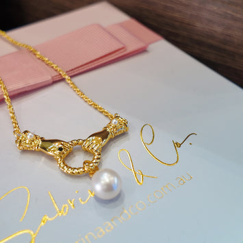 Gloves with hanging pearl necklace