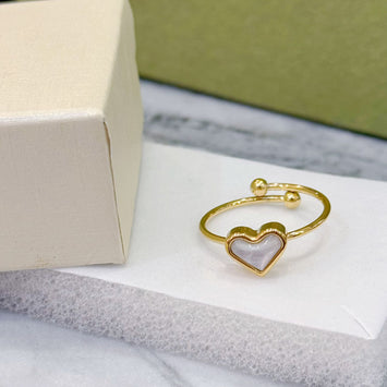 Gold shell heart ring