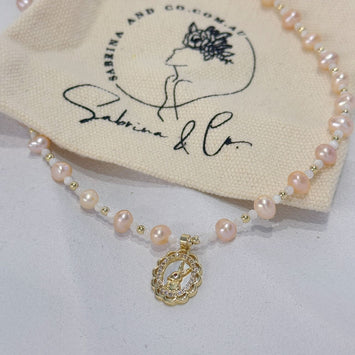 Pink pearl with rabbit pendant