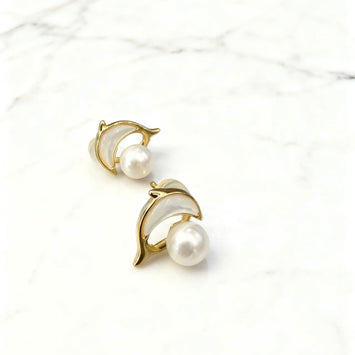 Shell dolphin with pearl earrings