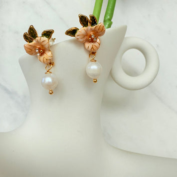 Orange flower with hanging pearl earrings