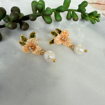 Orange flower with hanging pearl earrings