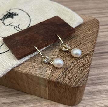 Butterfly with hanging pearl earrings