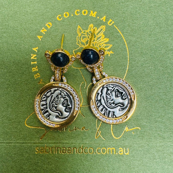 Black stone with hanging human face earrings