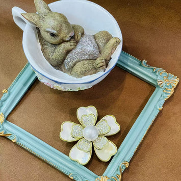 Shell flower with pearl brooch