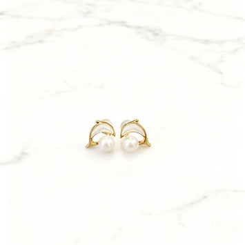 Shell dolphin with pearl earrings