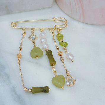 Hanging pearl and gemstone brooch