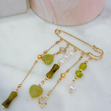 Hanging pearl and gemstone brooch