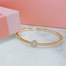 Shell cross bangle