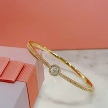 Shell cross bangle