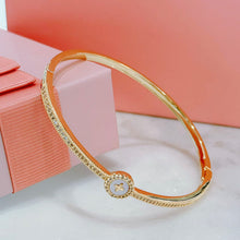Shell cross bangle