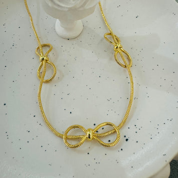Triple bow necklace