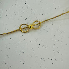 Triple bow necklace