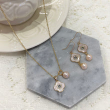 Pink shell with hanging fresh water pearl set