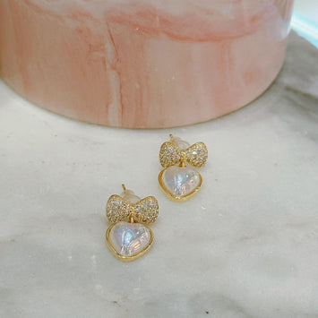 Diamond bow with hanging heart earrings