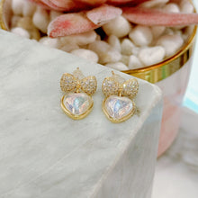 Diamond bow with hanging heart earrings