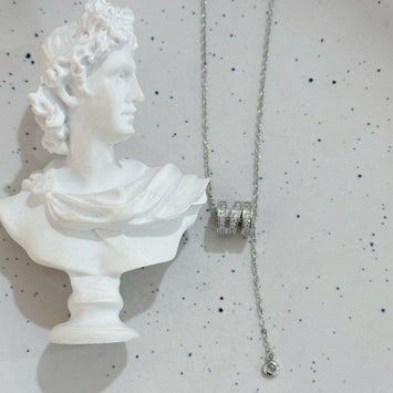 Triple loop with hanging diamond necklace