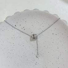 Triple loop with hanging diamond necklace