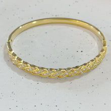Golden twisted bangle