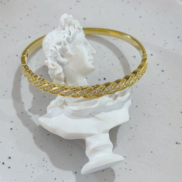 Golden twisted bangle