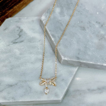Gold bow necklace
