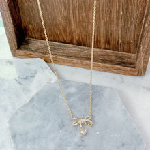 Gold bow necklace