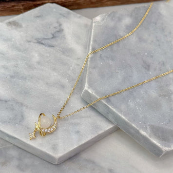 Gold planet necklace