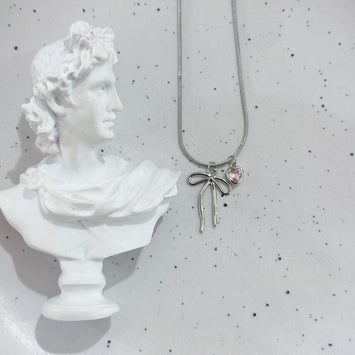Sliver bow and pink heart necklace