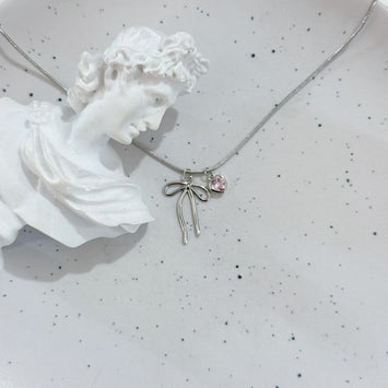 Sliver bow and pink heart necklace