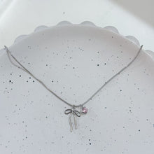 Sliver bow and pink heart necklace