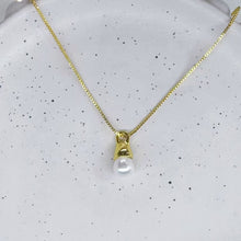 Hanging pearl necklace