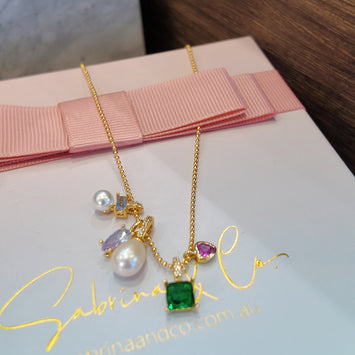 Hanging pearl and gemstone necklace