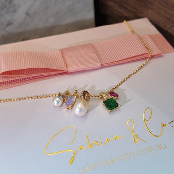 Hanging pearl and gemstone necklace