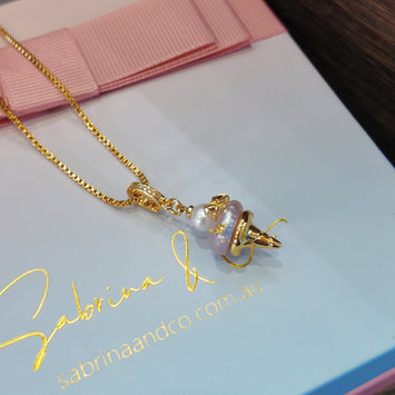 Hanging pink pearl necklace