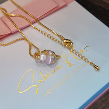 Hanging pink pearl necklace