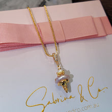 Hanging pink pearl necklace