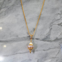 Hanging pink pearl necklace