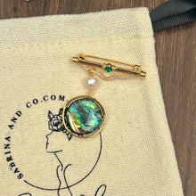 Hanging pearl and shell brooch