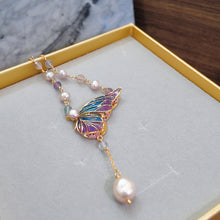 Butterfly with hanging pearl necklace
