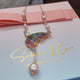 Butterfly with hanging pearl necklace