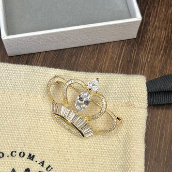 Golden crown brooch