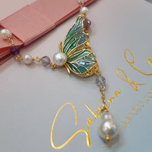 Butterfly with hanging pearl necklace