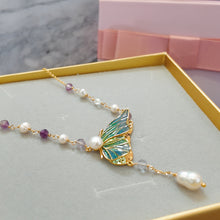 Butterfly with hanging pearl necklace