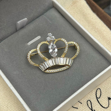 Golden crown brooch