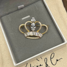Golden crown brooch