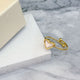 Gold shell heart ring