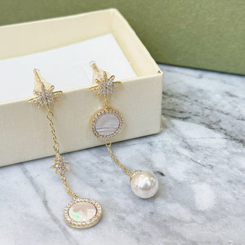 Shell and pearl star earrings