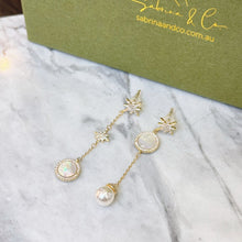 Shell and pearl star earrings