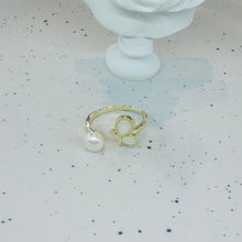 Shell wing with pearl ring
